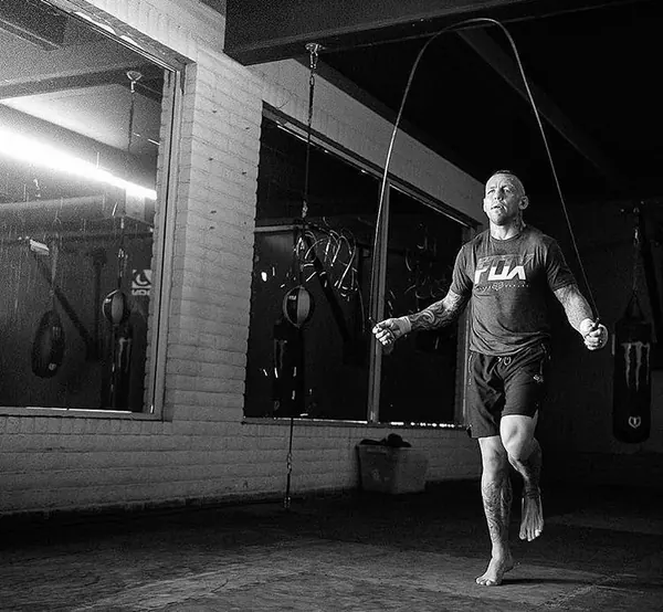 Ross Pearson skipping rope in the dimly lit gym